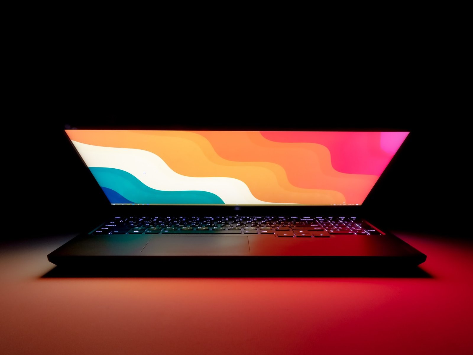 Refurbished laptop on a dark desk